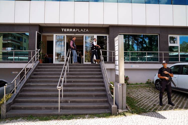 Police outside an Istanbul office building on Aug. 16. The police that day raided 44 firms suspected of supporting coup plotters. PHOTO: BRAM JANSSEN/ASSOCIATED PRESS